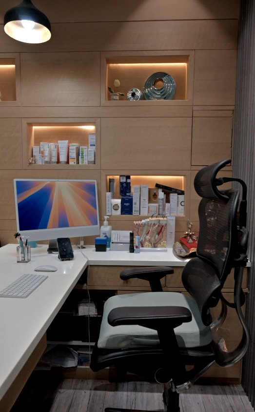 Doctor’s desk with shelves of skincare products